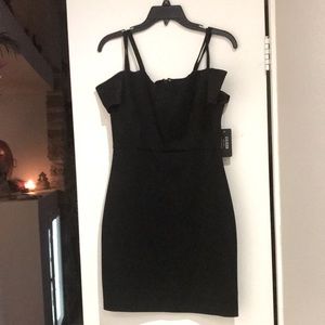 Black Guess cocktail dress never worn. Small size 6